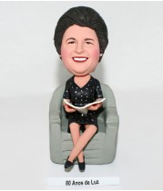 Lovely Mom Sitting on a Chair and Reading Newspaper Bobblehead