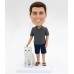 Man In Shorts and T-shirt with a Pet Bobblehead