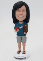 Woman Holding a Book and a Tomato Bobblehead