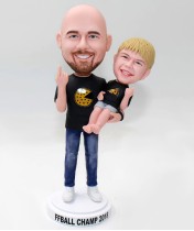 Casual Daddy in Jeans Carries His Son Bobbleheads