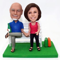 Couple Bobblehead Sitting On The Chair