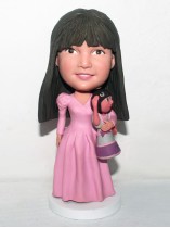 Bobblehead Princesses Girl Holding a Dora Doll
